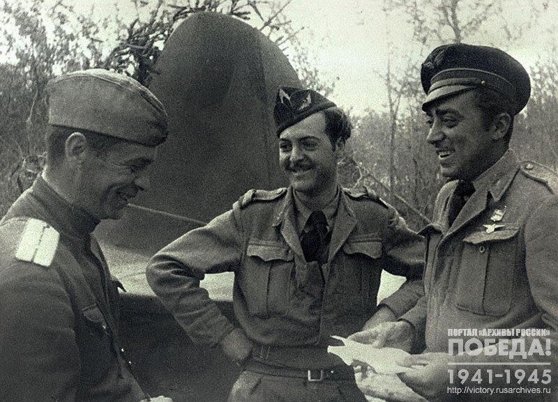 French pilots talk to a Soviet officer during leisure time