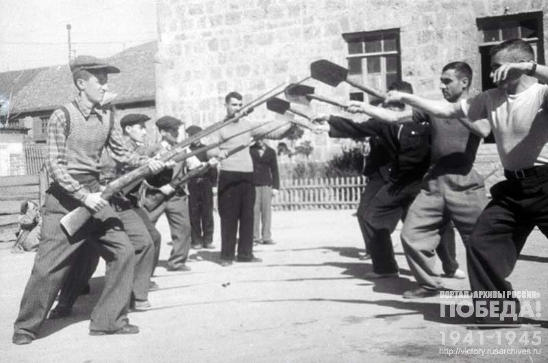 Fighters of the Vsevobuch unit are trained to repel a bayonet prick with a small sapper shovel during training at the Vsevobuch base in the Molotov District of Tbilisi