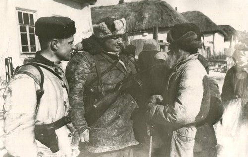 Mikheev N.K. and Fedoseenko V.A. - partisans, talking with residents of the village of Panyushkino, Kursk district, Kursk region. 
