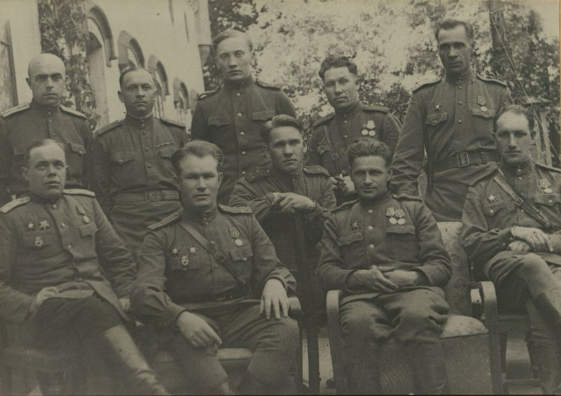 Image: From left to right 1st row: Chief of the Sanitary Service of the Guards Division, Major of the Medical Service of Morugiy, Deputy Division Commander for Logistics of the Guards, Lieutenant Colonel Krolevetsky, Head of the Organizational Planning Department of the Division's Logistics Division, Senior Lieutenant of the Quartermaster Service Kozlov, Divisional Veterinarian of the Department of Veterinary Services, Chief Veterinary Officer division Senior Lieutenant Sirotin. 2nd row: Chief of the financial department of the division, captain of the quartermaster service Annenkov, chief of food and fodder supplies of the division, captain of the quartermaster service Zaitsev, commander of the 436th separate medical and sanitary battalion, major of the medical service Paltarak, head of the field cash desk of Bosbank No. 781 captain of the quartermaster service trophy weapons of the division captain Kuznetsov