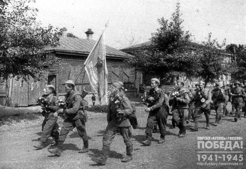 Soviet troops passing along the streets of liberated city  Oryol