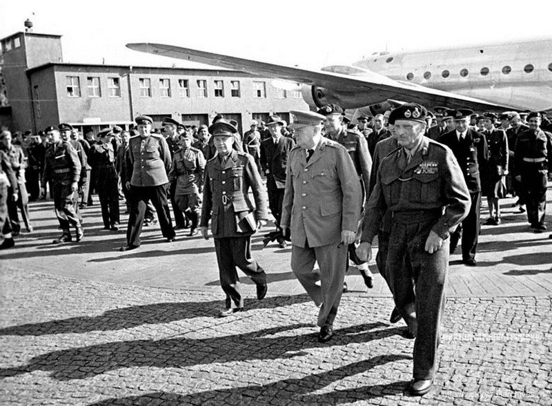 British Prime-Minister W. Churchill walks through airfield on arrival day to  Berlin Conference